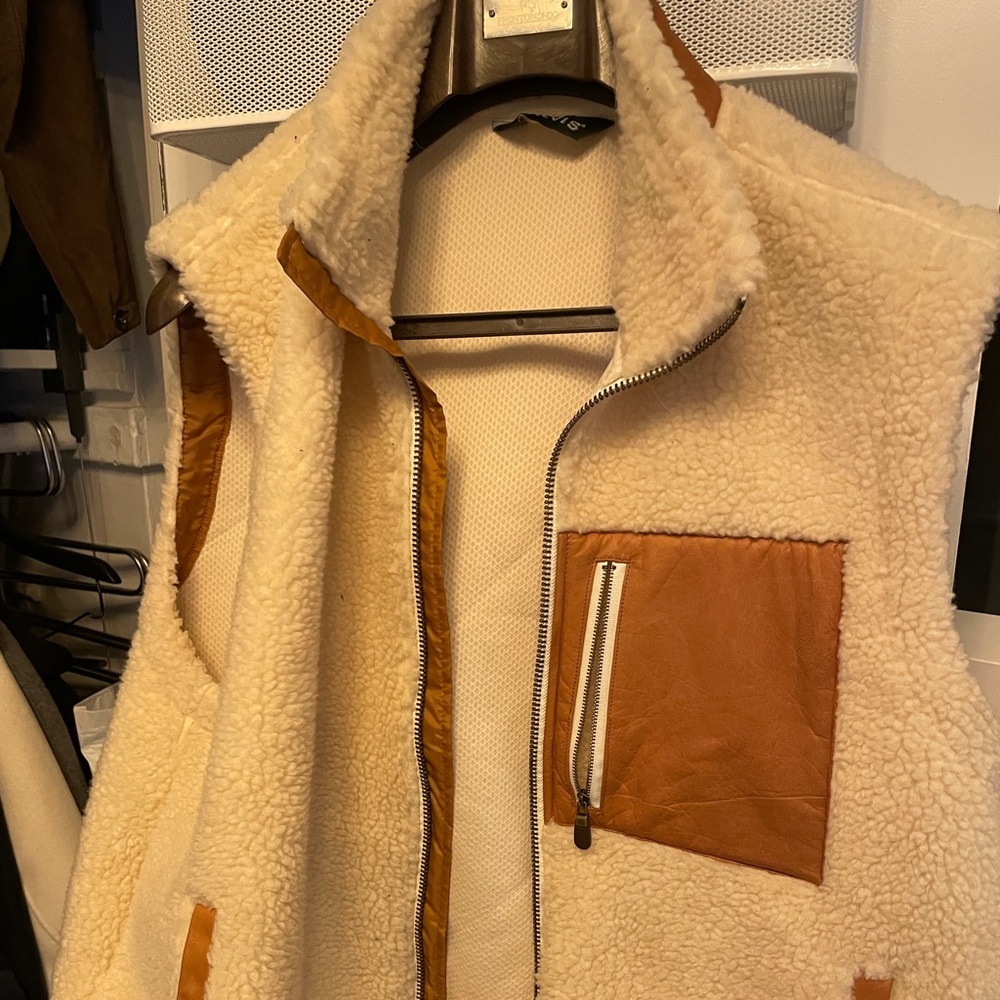 Fuzzy vest with leatherette trim. Reads XL but is an XXL!